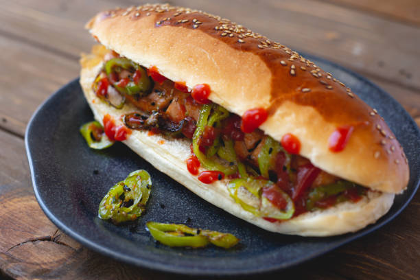 istock Hot dog with fried sausage and green pepper 1437291603