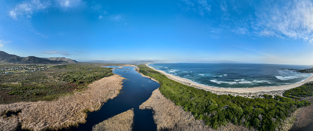 Aerial view over a large estuary near the coast. Kleinmond Estuary near Cape Town.