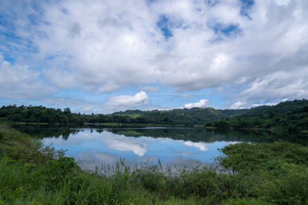 istock Wang Bon Reservoir, surrounded by trees and mountains 1437293724