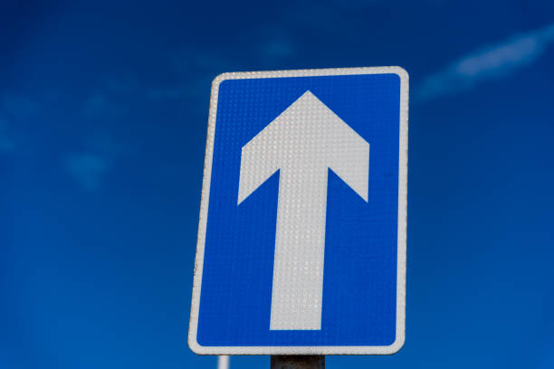 istock One way sign set against a blue sky 1437296048