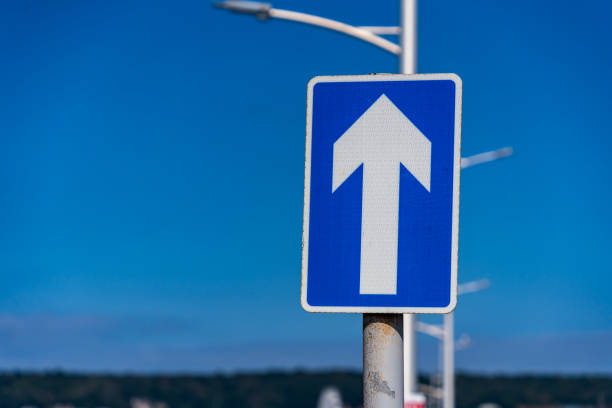 istock One way sign set against a blue sky 1437296506
