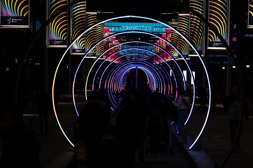 London, United Kingdom – December 27, 2019: The Sonic Runway, a 130m corridor of lighted rings at the Winterfest light festival in Wembley Park, London.