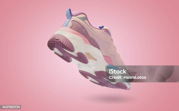 Flying Colorful Womens Sneaker On Blue Background Fashionable Stylish Sports Shoe Stock Photo - Download Image Now
