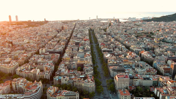 Aerial view of Barcelona city skyline, Passeig de Gracia and Eixample residential district at sunrise. Catalonia, Spain This elegant, majestic boulevard was a showcase for Barcelona's bourgeoisie at the turn of the 19th century, and links the Plaça Catalunya with the district of Gràcia, hence its name. avenida diagonal stock pictures, royalty-free photos & images