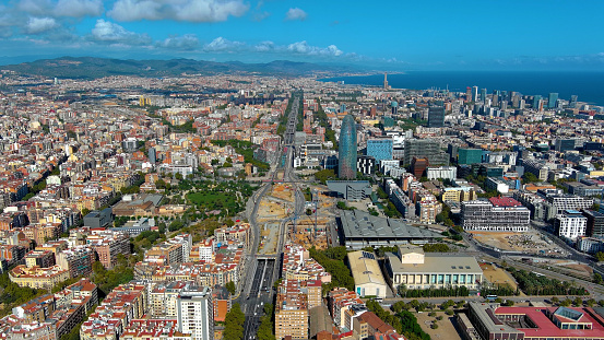 Aerial view of Barcelona Urban Skyline and Agbar Tower or Torre Glories during a sunny day in Barcelona, Catalonia, Spain