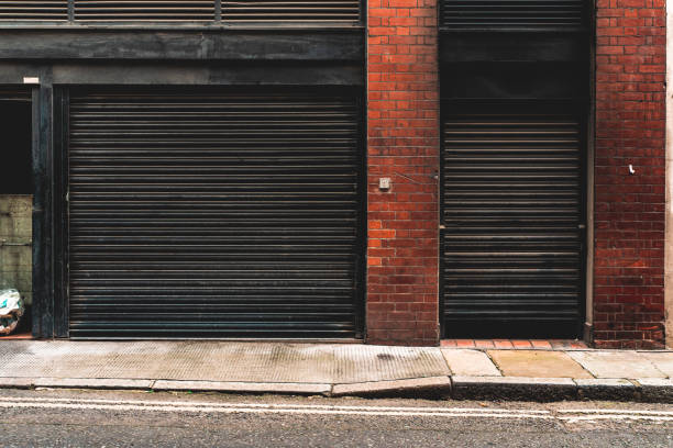 Garage door of warehouse Garage door of warehouse store wall surrounding wall facade stock pictures, royalty-free photos & images