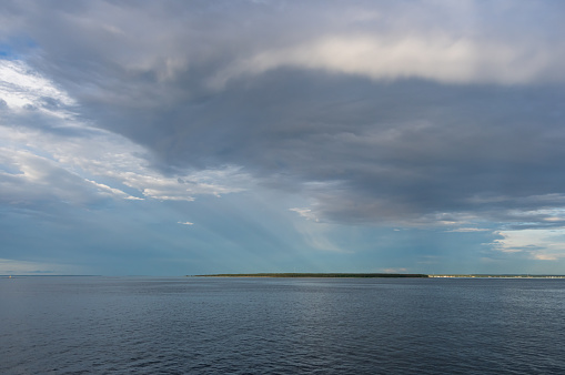 Beautiful clouds over the Baltic sea in summer evening.