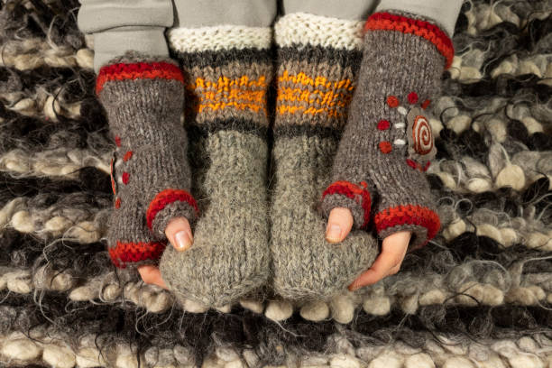 istock Close-up of warm woolen mittens and socks. 1437319295