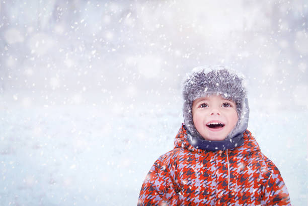 istock Happy child enjoying winter snowy day. 1437324832