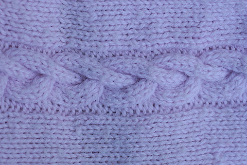 lilac  violet texture of fabric made from woolen cloth of clothing with knitted pattern