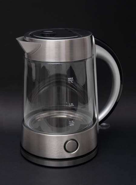 istock Modern electric kettle close up  on a black background 1437327006