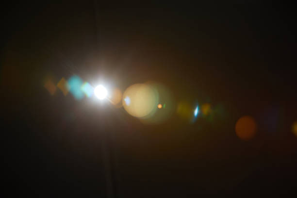 Image of abstract natural lens flare on black background Image of abstract natural lens flare on black background lens flare stock pictures, royalty-free photos & images