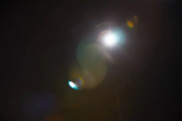 Photo of Image of abstract natural lens flare on black background