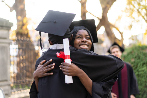 istock Young student is embracing each other after the graduating ceremony 1437334804