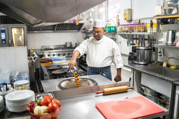 istock Indian chef cooking in tandoori oven 1437338496