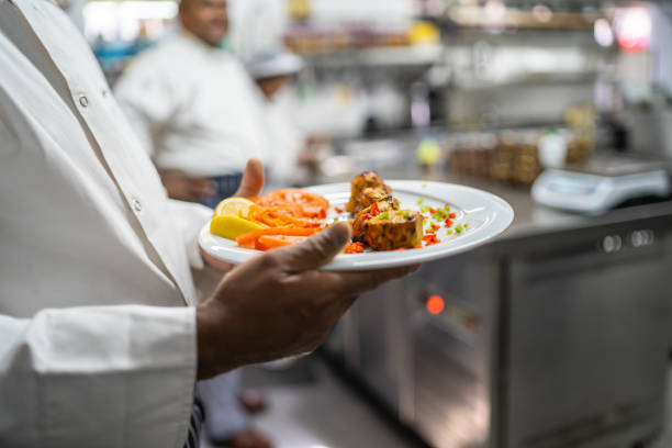istock Plate of freshly cooked food in restaurant kitchen 1437338503
