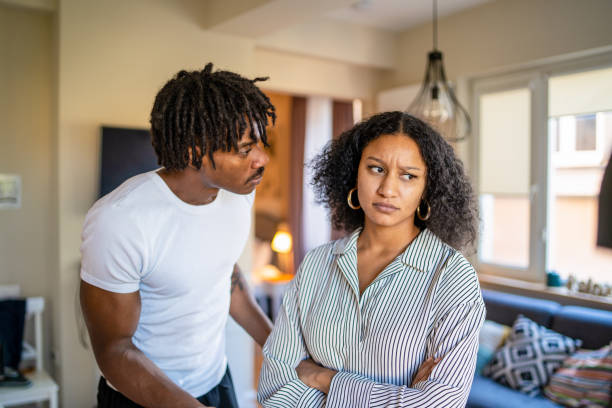 frowning woman after argument with husband - fighting imagens e fotografias de stock