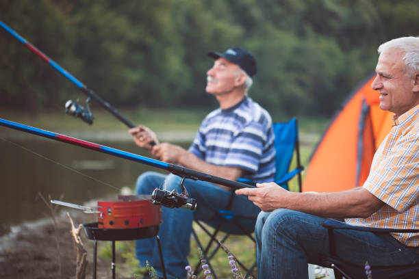 Two senior man relaxing and having fun. Fishing. Fishermen stock photo