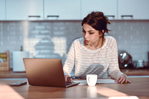 istock Female Writing Down Recipes In Notebook After Finding Them Online 1437341849