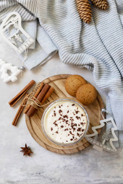 istock Latte spice coffee, warm pullover and Christmas decor on gray background.  Seasonal winter concept with hot drink, creative flat lay. View from above. 1437344559