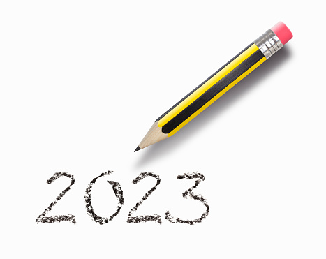 Old pencil writing 2023 on white background