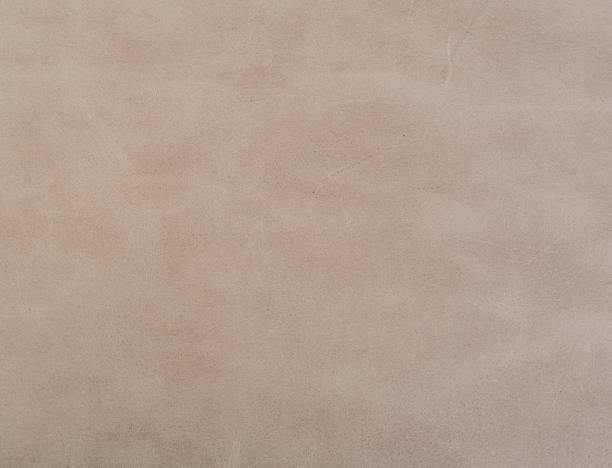 istock Closeup shot of a patterned leather light brown surface - perfect for background 1437348311