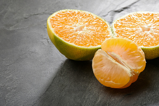 Whole, cross section and quarter of fresh organic navel orange with leaves in perfect shape on white isolated background, clipping path. Orange have vitamin c, sweet and delicious. Fresh fruit concept