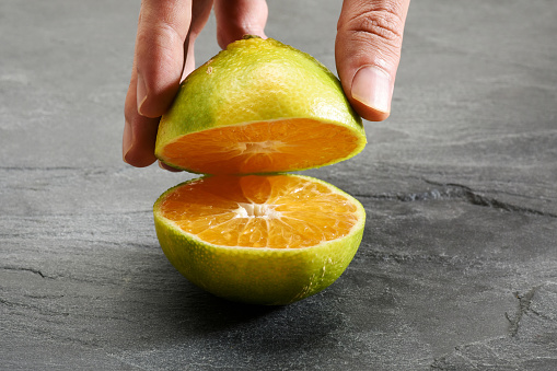 peel from tangerines peeled on a wooden table, orange peel to throw in the trash