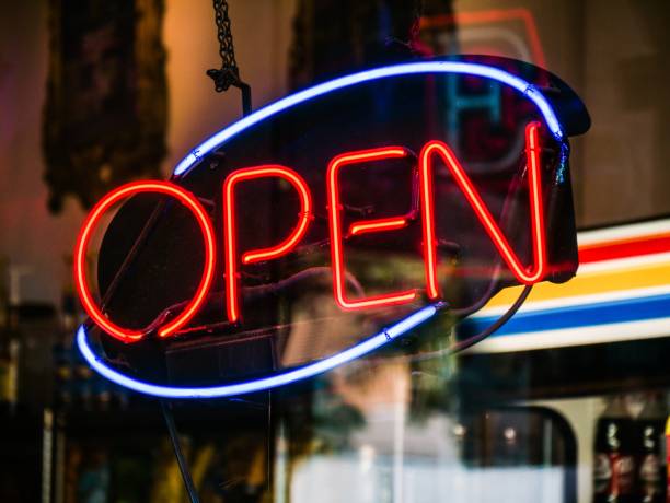 istock Electric sign with lights and with [OPEN] written on it 1437355490