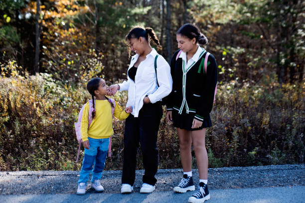 istock Three sisters dressed with style ready to go to school. 1437355754