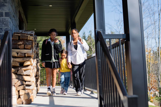 istock Three sisters dressed with style ready to go to school. 1437355810