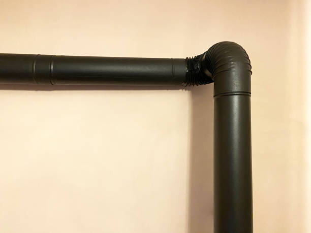 istock Wood burning stove, stove pipe on the wall 1437358450