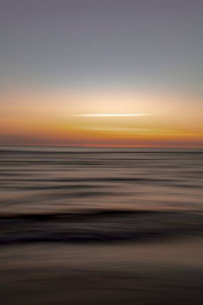 istock Long exposure of sea waves on the sunset 1437359666