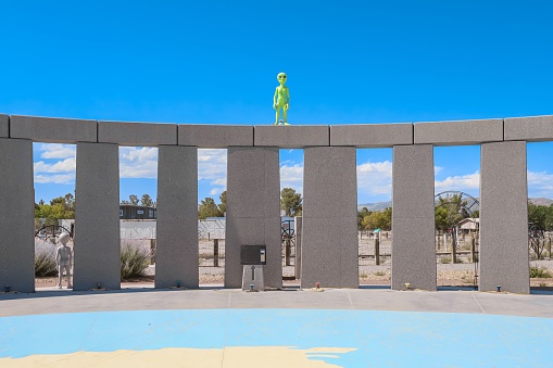 Alamo, Nevada, United States – June 07, 2020: An alien statue stands atop the Stonehenge Replica monument at Southern Nevada's Western Elite landfill ranch and property is open for public visits.