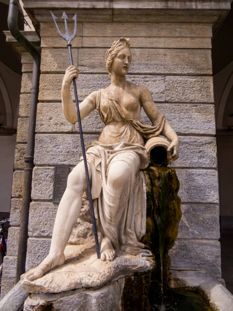 Statue of Queen Amphitrite the Queen of Atlantis and wife of King Neptune, Aosta, Italy View of the Statue of Queen Amphitrite the Queen of Atlantis and wife of King Neptune in Emile Chanoux square, Aosta, Italy goddess of ocean stock pictures, royalty-free photos & images