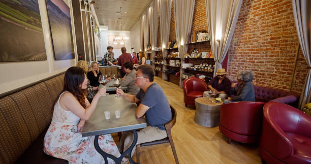 istock Customers Drinking and Chatting in Busy Wine Bar 1437375959