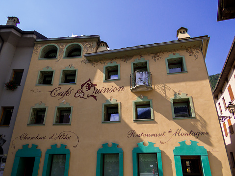 Morgex, Italy - August 5, 2022: View of the Cafe Quinson and the Hotel de Chambres in the old town.