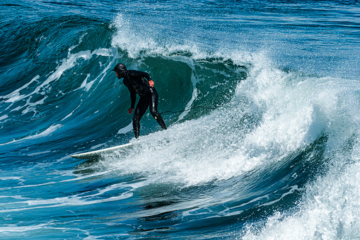 Large ocean wave and a surfer riding the front of the wave

Taken in Santa Cruz, California, USA