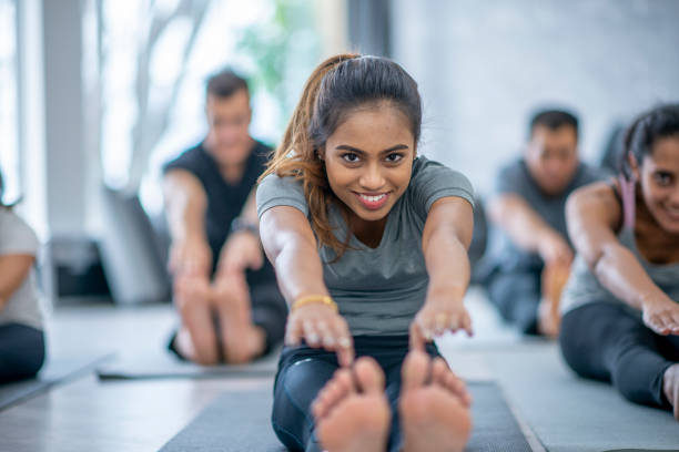 istock Woman Stretching in a Fitness Class 1437379059