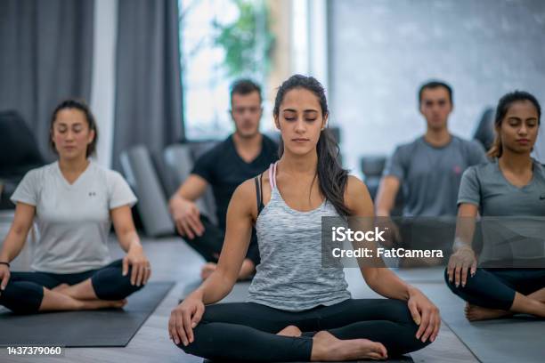 Woman Meditating Stock Photo - Download Image Now - 18-19 Years, 20-24 Years, 25-29 Years