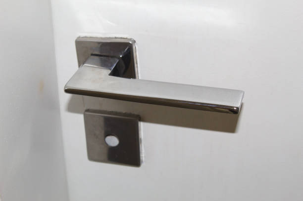 istock Lock and door handle made of silver metal 1437379700