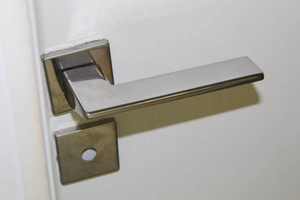 istock Lock and door handle made of silver metal 1437379743