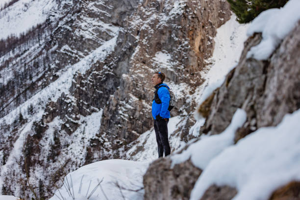 istock A Caucasian Trail Runner Pauses At Mountain Top In Winter 1437392285