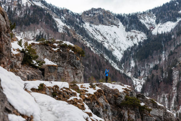 istock A Caucasian Trail Runner Pauses At Mountain Top In Winter 1437392321