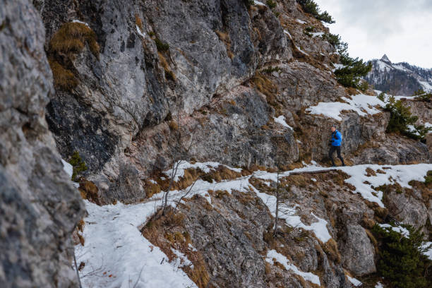 istock A Caucasian Trail Runner Taking A Run On A Snowy Mountain Path 1437392332
