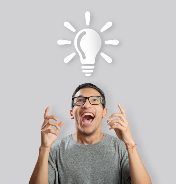 Man having an idea and looking upwards pointing at bulb illustration