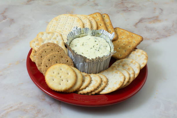 istock Cheese spread and plate of crackers 1437401319