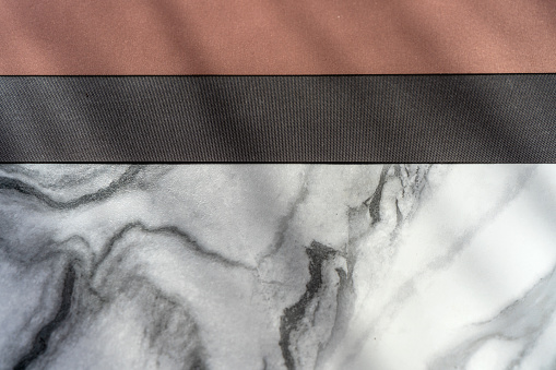 The texture of red and brown cloth on black and white marble