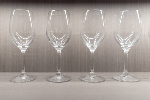 A neat row of empty clear glass goblets