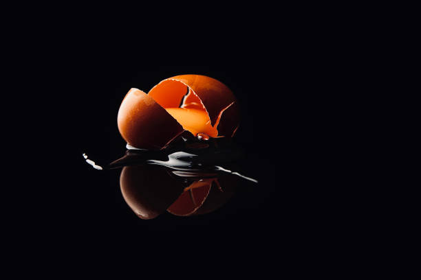 istock An egg falls and cracks, the shell breaks, and the egg runs out - stock photo 1437405092